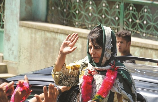 Jammu and Kashmir Chief Minister Mehbooba Mufti waves to supporters during an election campaign in Anantnag yesterday.