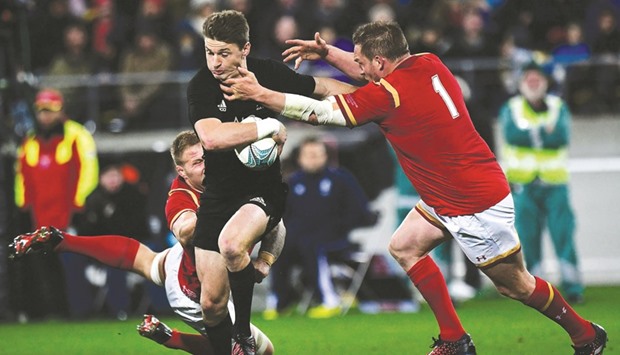 New Zealandu2019s Beauden Barrett (C) is tackled by Rob Evans (R) and Josh Turnbull (L) of Wales during the rugby Test match in Wellington yesterday. (AFP)