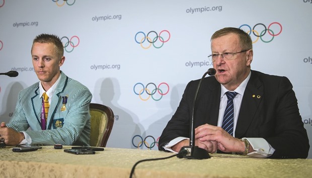 File picture of IOC vice-president & Australian Olympic chief John Coates (R) speaking during a press conference after Australian athlete Jared Tallent was presented with his 2012 Olympics gold medal.