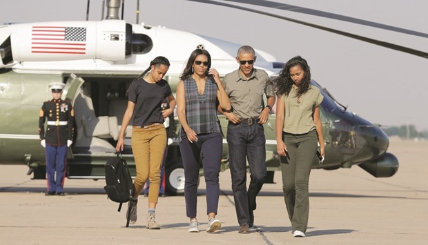US president Barack Obama and his family walk to Air Force One as they depart from Roswell, New Mexico.