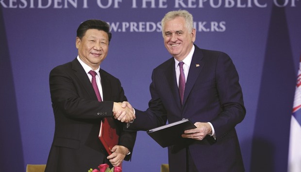 Chinau2019s President Xi Jinping (left) and his Serbian counterpart Tomislav Nikolic shake hands after signing an agreement in Belgrade yesterday.