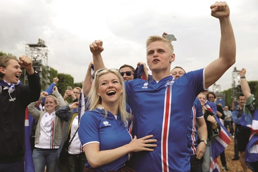 Icelandu2019s supporters react as they watch the match between Iceland and Hungary in the Paris fan zone.
