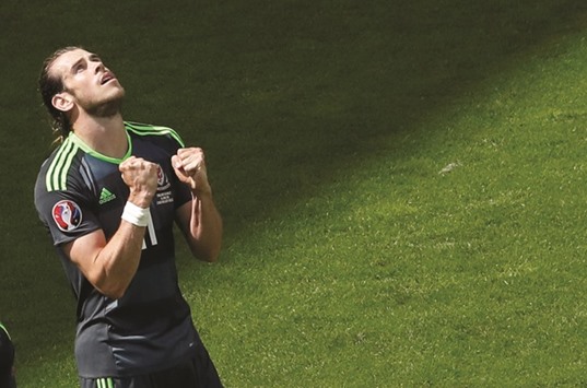 File picture of Wales striker Gareth Bale celebrating after scoring a goal against England. Wales face Russia in a crucial tie today.