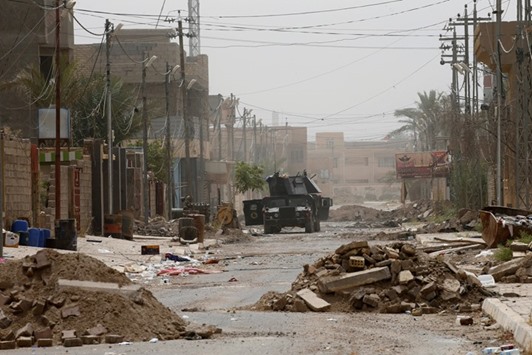 An Iraqi security forces vehicle is seen on a street in the centre of Fallujah.