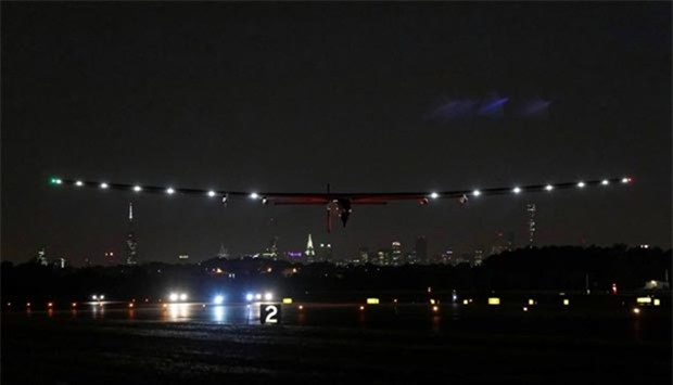 Bertrand Piccard of Switzerland pilots the Solar Impulse 2 aircraft as it takes off from John F. Kennedy International Airport in New York early on Monday.