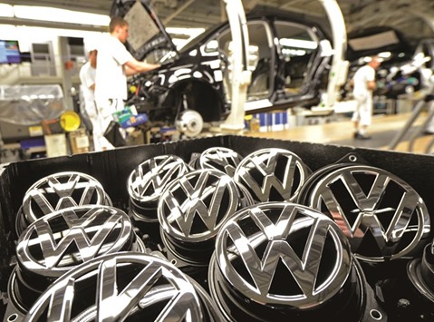 Emblems of Golf VII car are pictured in a production line at the Volkswagen plant in Wolfsburg. Small shareholders are likely to use the AGM tomorrow in the northern city of Hanover to let off steam at the way management has handled the emissions scandal.