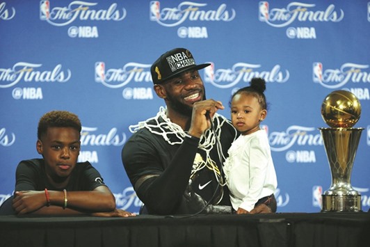 Cleveland Cavaliers forward LeBron James (23) speaks to media with his children Lebron James  Jr. and Zhuri James present following the 93-89 victory against the Golden State Warriors in game seven of the NBA Finals on Sunday. Picture: Kelley L Cox-USA TODAY Sports