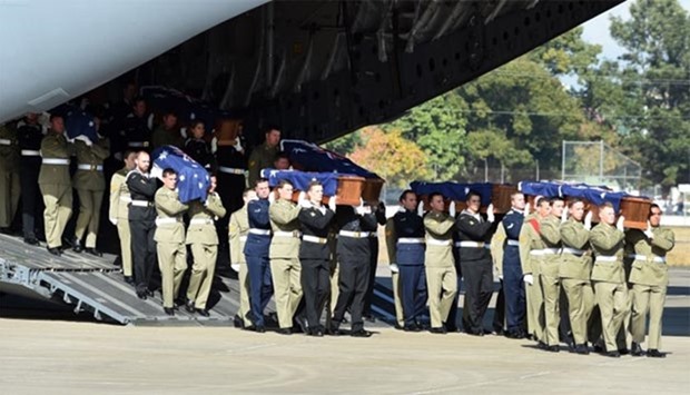 The remains of 25 Australian soldiers killed in the Vietnam War arrive at the Richmond Air Force base near Sydney to a full military ceremony.