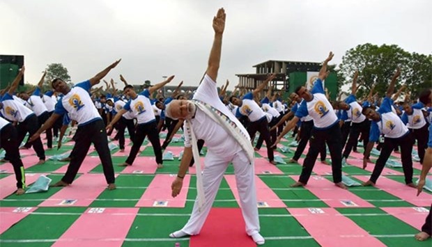 Prime Minister Narendra Modi takes part in a yoga demonstration at the Capitol Complex in Chandigarh on Tuesday.