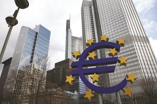 The stars of European Union (EU) membership sit on a euro sign sculpture outside the headquarters of the European Central Bank (ECB) in Frankfurt. Starting tomorrow, euro-area banks can bid for a four-year loan from the ECB at an interest rate that begins at zero and could ultimately be negative.