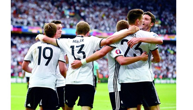 Germanyu2019s forward Mario Gomez celebrates his goal with team mates during their Euro 2016 Group C football match against N. Ireland in Paris yesterday.
