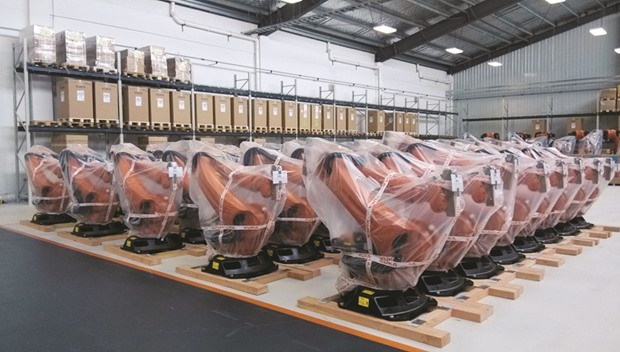 Robots covered in plastic sheets are seen at a plant of Kuka Robotics in Shanghai. Kuka is the latest and biggest German industrial technology group to be targeted by a Chinese buyer as the worldu2019s second-largest economy makes the transition from a low-cost manufacturer into a high-tech industrial hub.