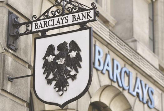 A Barclays sign hangs outside a branch of the bank in the City of London. Barclays, HSBC Holdings, Lloyds Banking Group, Standard Chartered and Royal Bank of Scotland Group have collectively sold u20ac85bn of holding-company debt and u20ac29bn of AT1s, data compiled by Bloomberg show.