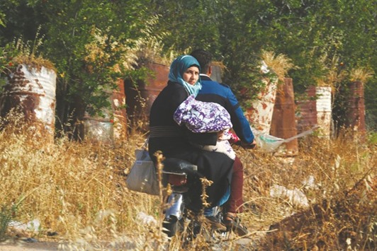 Residents flee violence on the outskirts of the Syrian rebel-held city of Idlib.