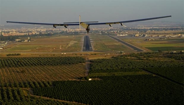 Solar Impulse 2, piloted by Swiss pioneer Bertrand Piccard, prepares to land in Seville, after finishing a 70-hour flight over the Atlantic Ocean on Thursday.
