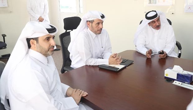 HE the Prime Minister and Minister of Interior Sheikh Abdullah bin Nasser bin Khalifa al-Thani listens to a briefing by Qatar Rail officials.