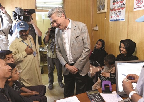 The United Nations High Commissioner for Refugees Filippo Grandi meets Afghan refugees at the UNHCR registration centre in Peshawar.
