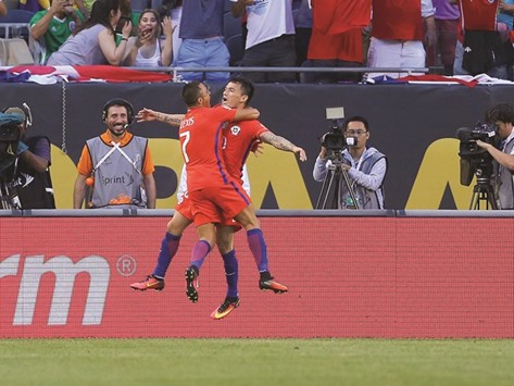 Chile midfielder Charles Aranguiz (right) and forward Alexis Sanchez celebrate a goal against Colombia during their Copa America semi-final match. (USA TODAY Sports)