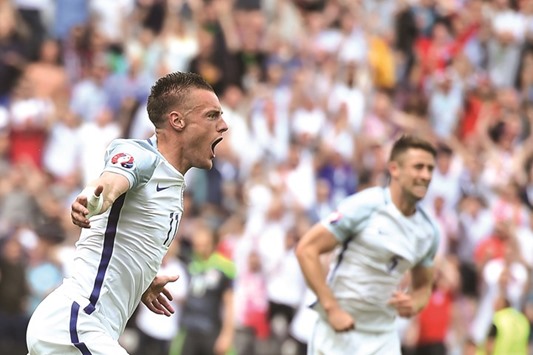 Englandu2019s Jamie Vardy celebrates after scoring a goal against Wales in Lens on June 16, 2016. Wales stole a march over England by finishing top of Group B despite losing the clash between the two, and Bale was clearly delighted. (AFP)
