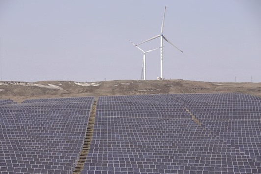 Wind turbines and solar panels are seen at an energy storage and transmission power station from State Grid Corporation of China in Zhangjiakou of Hebei province. China is the worldu2019s top generator of electricity from wind turbines, with 145 GW of installed capacity, but most of this is onshore.