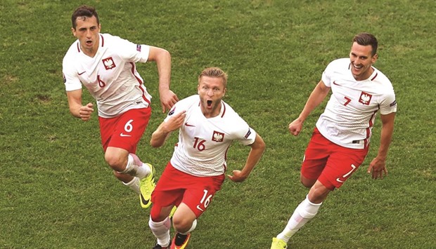 Jakub Blaszczykowski (centre) netted the only goal in Poland's 1-0 win over Ukraine that helped them enter the Euro last 16 stage