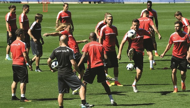 Switzerland players attend a training session yesterday ahead of their Euro Championships Round of 16 clash against Poland today. (AFP)