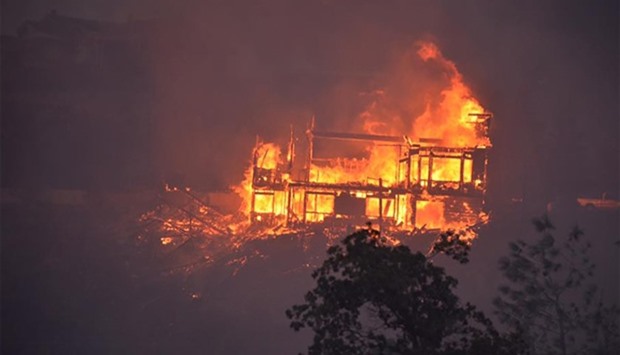 A house burning in the Erskine Fire near Lake Isabella, California