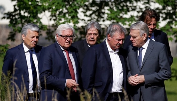 Ministers walk through the Park of the German Foreign Ministery guest house before a foreign ministe