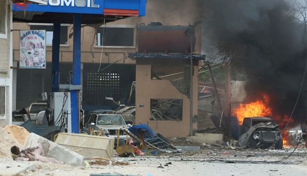 A Somali government soldier holds his position during gunfire after a suicide bomb attack outside Nasahablood hotel in Somalia's capital Mogadishu.