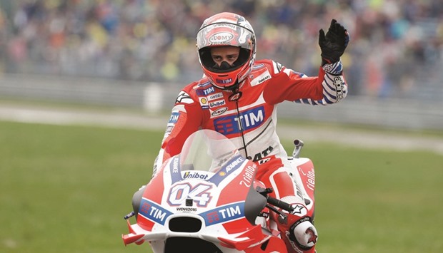 Andrea Dovizioso of Italy rides his Ducati during the Dutch MotoGP qualifying yesterday. (AFP)