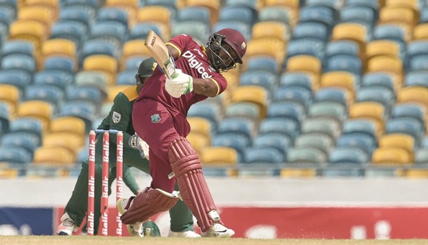 West Indiesu2019 batsman Darren Bravo plays a shot en route to his 102 during the tri-nation match against South Africa at the Kensington Oval stadium in Bridgetown. (AFP)