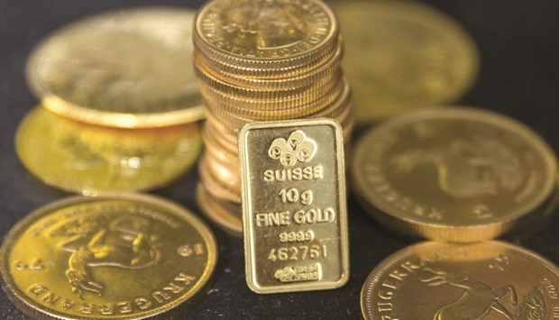 Gold bullion is displayed at Hatton Garden Metals precious metal dealers in London. In Londonu2019s spot gold market, prices jumped as much as 8.1%, the most since the height of the global financial crisis in 2008.