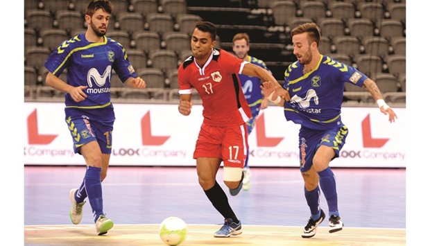 Al Rayyan's Nunes (centre) attempts to get past Inter Movistar players during a Group B encounter on the opening day of the Futsal Intercontinental Cup at Ali Bin Hamad Al Attiyah Arena in Doha. PICTURES: Shemeer Rasheed