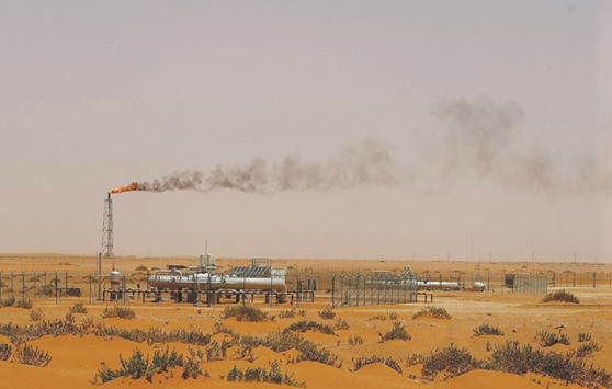 Picture taken on June 23, 2008 shows a flame from a Saudi Aramco oil facility known as u201cPump 3u201d in the desert near the oil-rich area of Khouris, 160km east of capital Riyadh. Despite near record production, the kingdomu2019s oil inventories have declined for six consecutive months, the longest stretch since the Joint Organisations Data Initiative started tracking Saudi supply levels nearly 15 years ago.