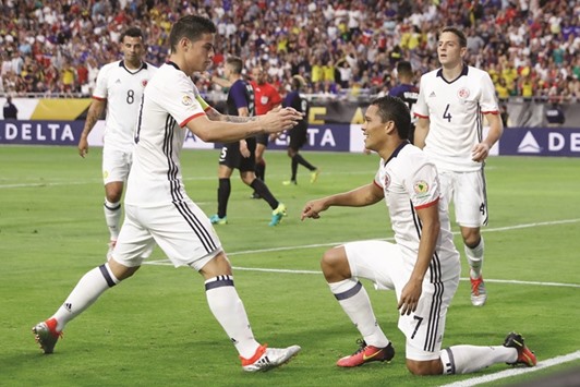 Carlos Bacca (No 7) of Colombia celebrates with James Rodriguez after Bacca scored a first half goal against the US in the 2016 Copa America Centenario third place match in Glendale, Arizona. (Getty Images/AFP)