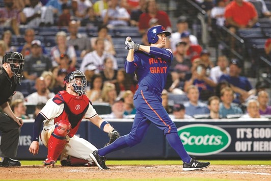 New York Mets second baseman Kelly Johnson hits a home run against the Atlanta Braves in the eleventh inning at Turner Field. PICTURE: USA TODAY Sports