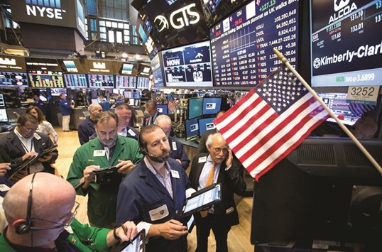 Traders work on the floor of the New York Stock Exchange. The S&P 500 Index dropped 3.6% on Friday, capping a five-day decline of 1.6%, as more than 15bn shares traded across US exchanges, double the daily average so far this year.