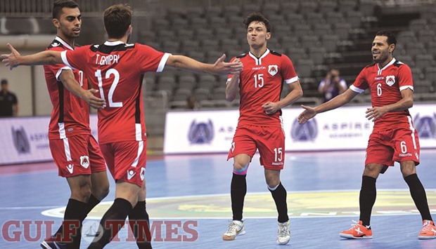 Al Rayyanu2019s Thiago Trippi (second from left) celebrates a goal with teammate Arthur Linhares (second from right) during their Futsal Intencontinental Cup match against Magnus Futsal on Saturday.PICTURE: Noushad Thekkayil