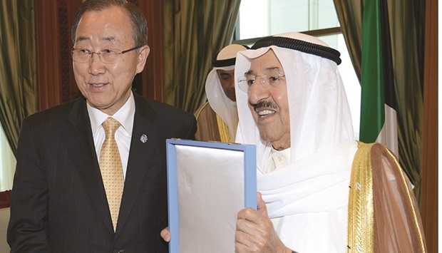 UN Secretary-General Ban Ki-moon receiving a medal from the Emir of Kuwait Sheikh Sabah al-Ahmad al-Jaber al-Sabah yesterday at Al-Sief Palace in Kuwait City.