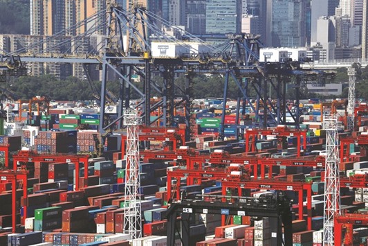 Containers at a terminal in Hong Kong. Profits of Chinese industrial companies in May rose to 537.2bn yuan ($81.21bn), the statistics bureau said yesterday.