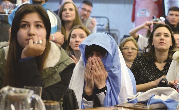 Argentine fans show their disappointment in Buenos Aires on Sunday night.