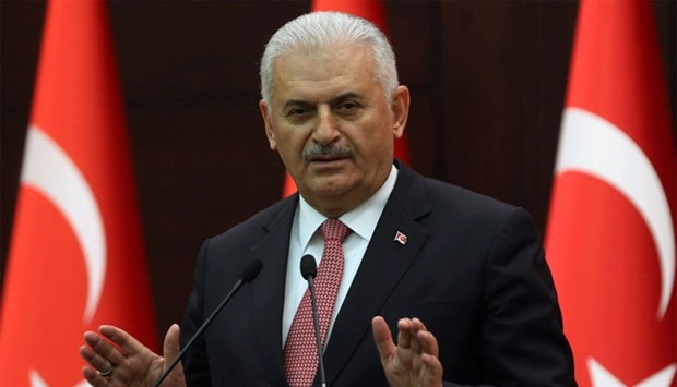 Turkish Prime Minister Binali Yildirim gestures as he delivers a speech during a press conference