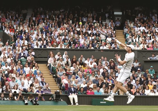 Great Britainu2019s Andy Murray in action against compatriot Liam Broady during their Wimbledon first round match at the All England Club in London yesterday. (Reuters)