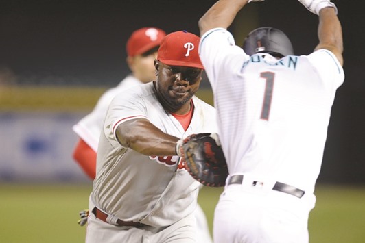 Philadelphia Phillies first baseman Ryan Howard tags out Arizona Diamondbacks centre fielder Michael Bourn for the final out during the ninth inning at Chase Field. The Phillies won 4-3. PICTURE: Joe Camporeale-USA TODAY Sports