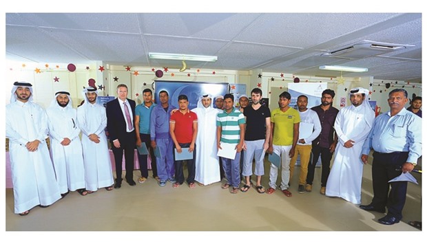 Qatar Rail officials with workers at the Iftar gatherings.