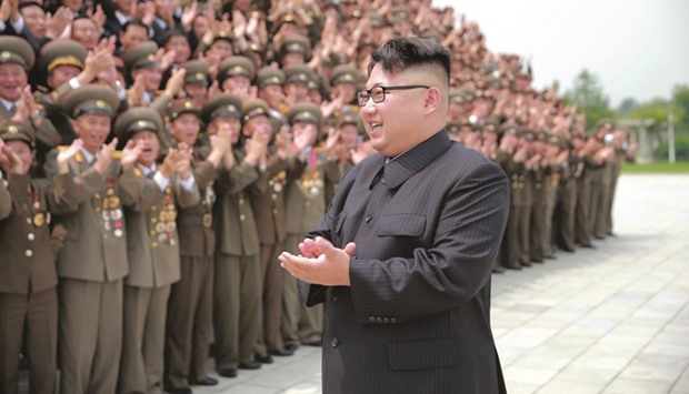 North Korean leader Kim Jong-Un participating in a photo session with officials who are committed to the success of the test-fire of surface-to-surface medium long-range strategic ballistic missile Hwasong-10, in this undated photo released by North Koreau2019s Korean Central News Agency (KCNA) this week.