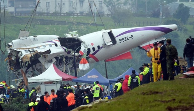 The  wreckage of a TransAsia plane wreckage being lifted in New Taipei City on February 5, 2015.