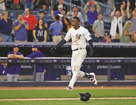 New York Yankees shortstop Didi Gregorius reacts rounding the bases after his walk-off home run in the ninth inning to defeat the Texas Rangers 9-7 at Yankee Stadium. PICTURE: USA TODAY Sports