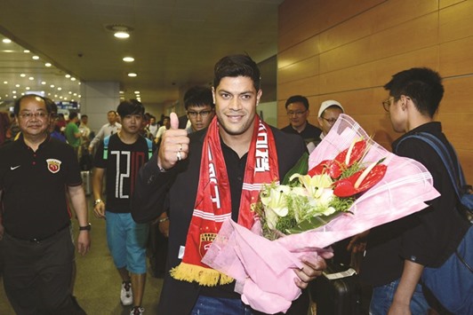 Brazilu2019s Hulk makes his way through the arrivals halls at Shanghai Pudong International Airport.(AFP)