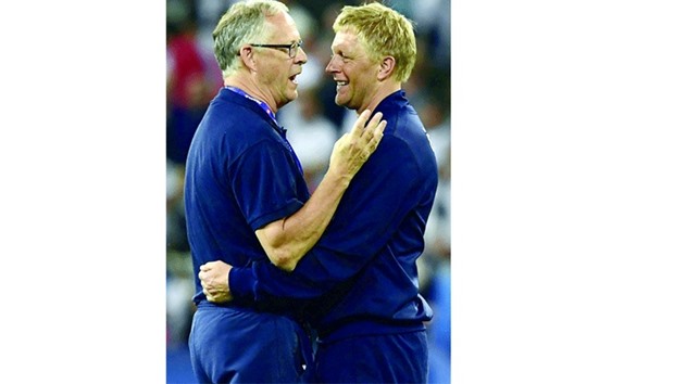 Icelandu2019s coaches Lars Lagerbaeck (L) and Hallgrimsson react as they celebrate their 2-1 win over England in the Euro 2016 round of 16 match at the Allianz Riviera stadium in Nice. (AFP)